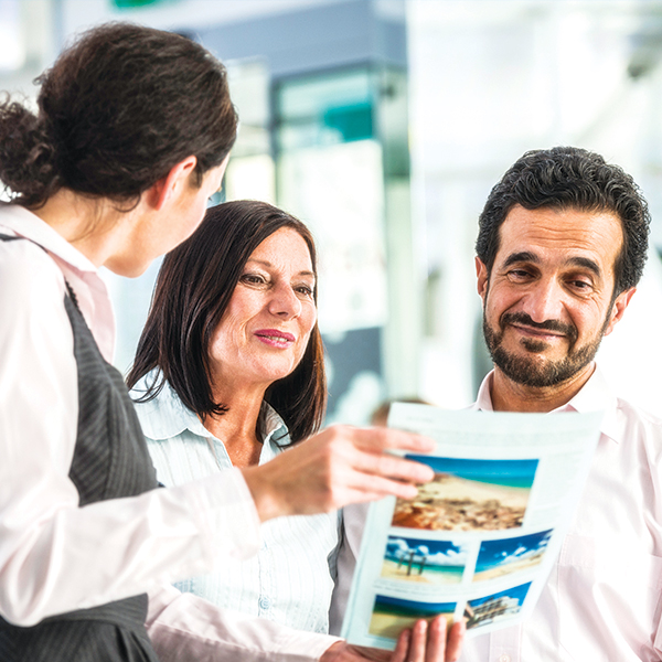 travel agent working with customers
