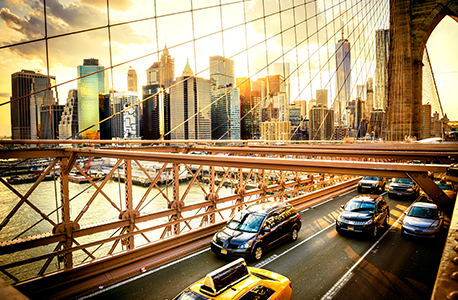 Cars driving over city bridge