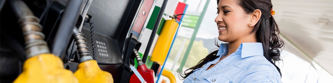 Woman pumping gas at SavOn