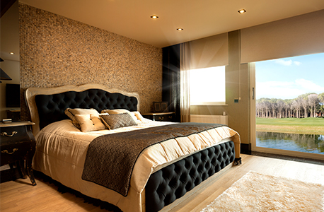 A hotel room overlooking a lake