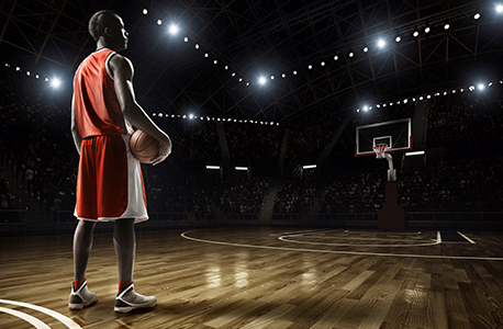 Man holding basketball on court 