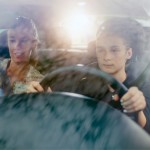 Teen driving with mother 