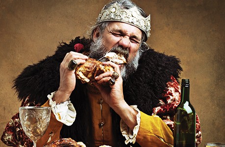 Medieval king eating feast