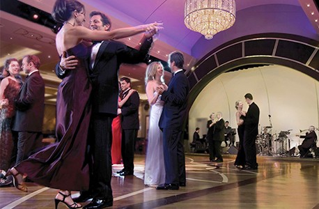 Multiple couples ballroom dancing