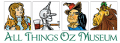 All Things Oz Museum Logo featuring Dorothy, Scarecrow, Tin Man, and Cowardly Lion